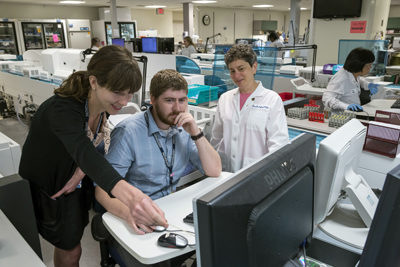 Dr. Sokoll and residents in the Core lab
